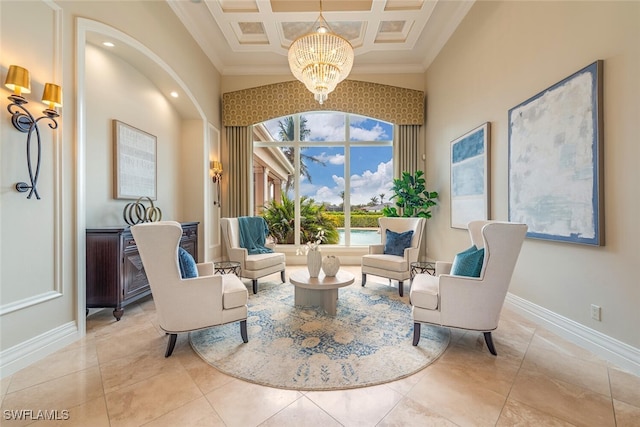 sitting room with crown molding, baseboards, a chandelier, a towering ceiling, and coffered ceiling