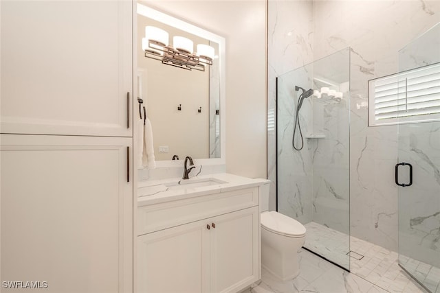 full bath with a marble finish shower, marble finish floor, toilet, and vanity