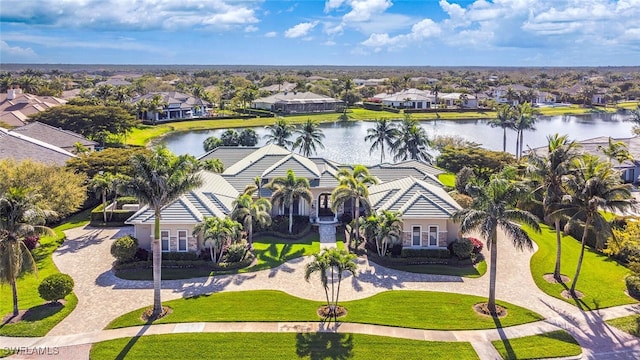 bird's eye view with a residential view and a water view