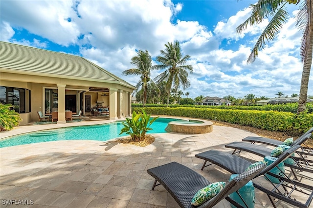 view of swimming pool featuring a patio area and a pool with connected hot tub