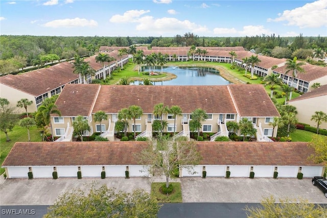 aerial view with a residential view and a water view