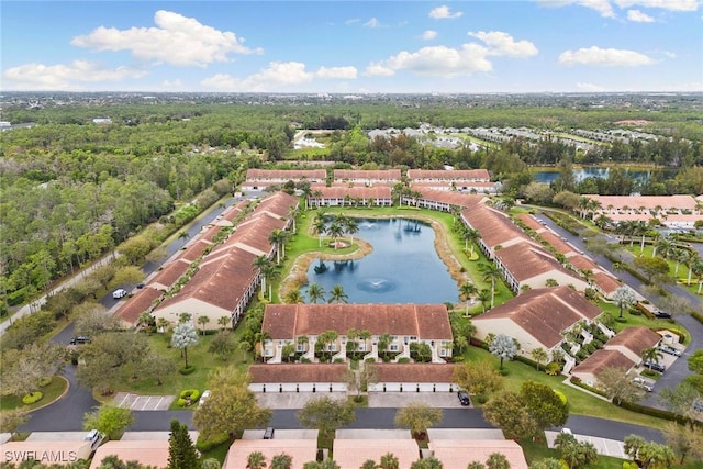 birds eye view of property with a water view and a residential view