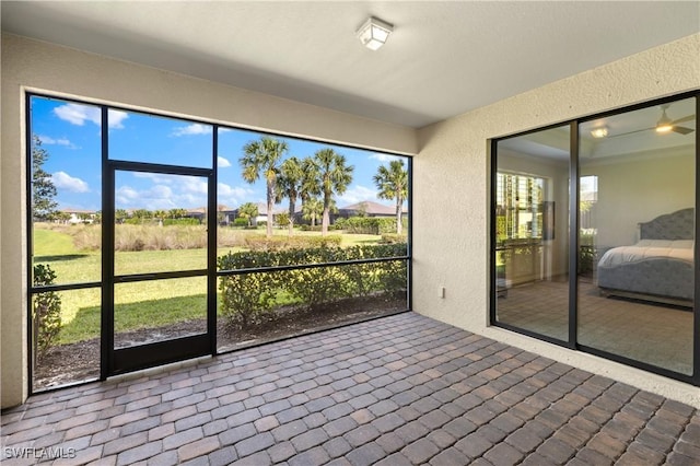 unfurnished sunroom with plenty of natural light