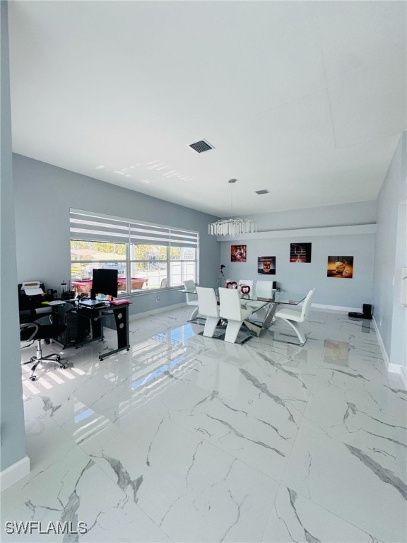 office space featuring marble finish floor, visible vents, and baseboards