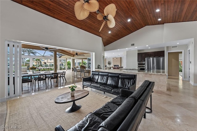 living area with high vaulted ceiling, wooden ceiling, recessed lighting, visible vents, and a ceiling fan