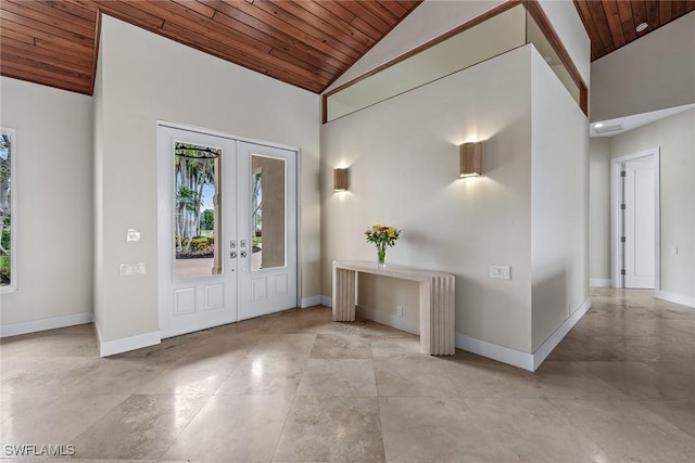 entryway featuring high vaulted ceiling, french doors, wood ceiling, and baseboards