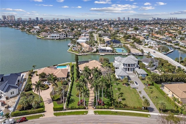 birds eye view of property with a water view and a residential view