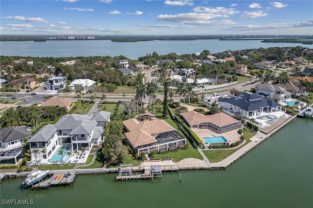 aerial view with a water view and a residential view