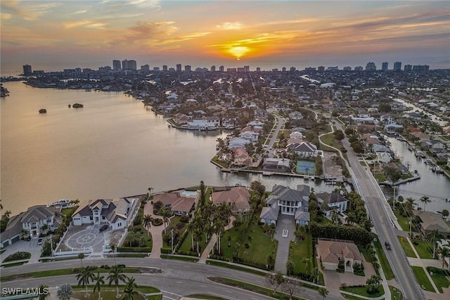 bird's eye view featuring a view of city and a water view