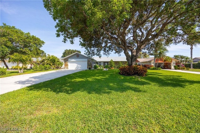 ranch-style home with driveway, a garage, a residential view, and a front lawn