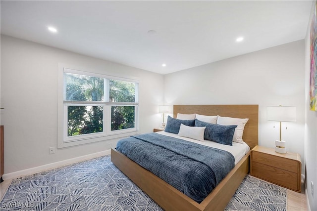 bedroom featuring recessed lighting and baseboards