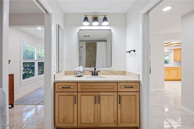 full bath with baseboards, marble finish floor, curtained shower, vanity, and recessed lighting