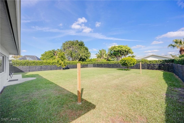 view of yard with a fenced backyard