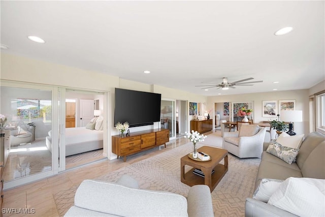 living area featuring a ceiling fan and recessed lighting