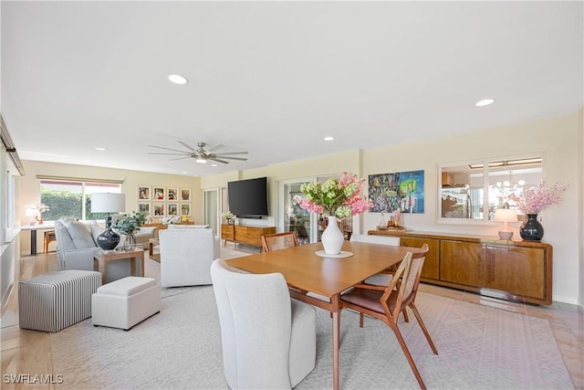 dining space with recessed lighting and ceiling fan with notable chandelier