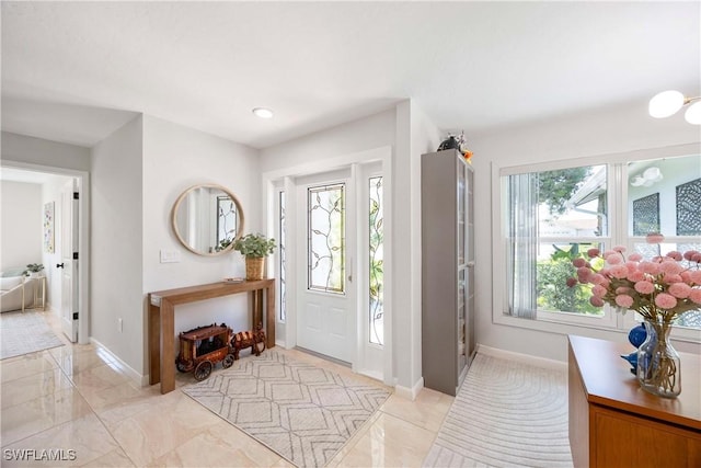 entrance foyer featuring baseboards