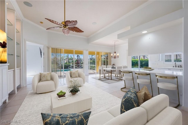 living room featuring a wealth of natural light, light tile patterned floors, and crown molding