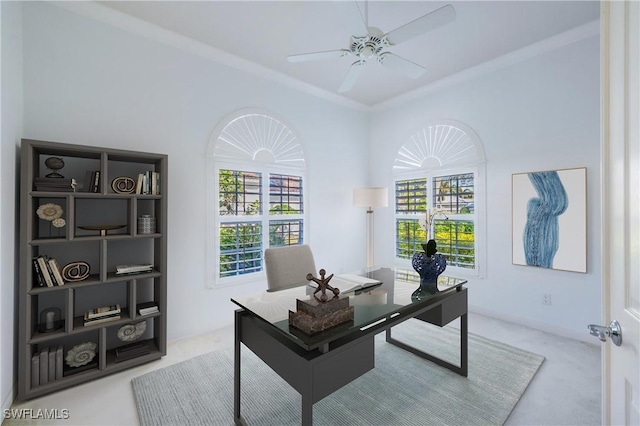 home office featuring carpet, ceiling fan, and crown molding