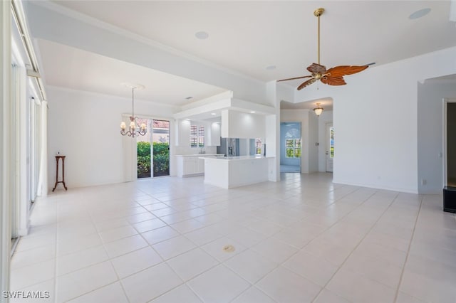 unfurnished living room with light tile patterned floors, ceiling fan with notable chandelier, and crown molding