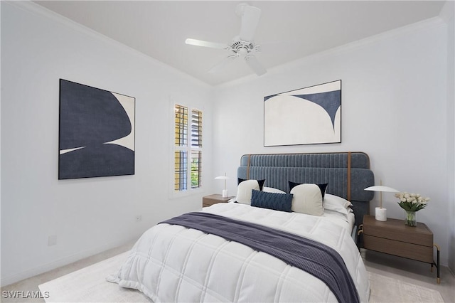 carpeted bedroom with crown molding, ceiling fan, and baseboards