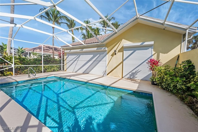 outdoor pool featuring a lanai and a patio area