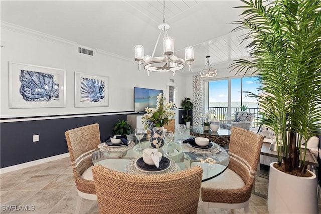 dining room with ornamental molding, visible vents, baseboards, and an inviting chandelier