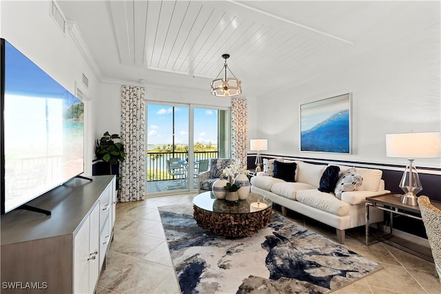 living area with ornamental molding, a wealth of natural light, visible vents, and a notable chandelier