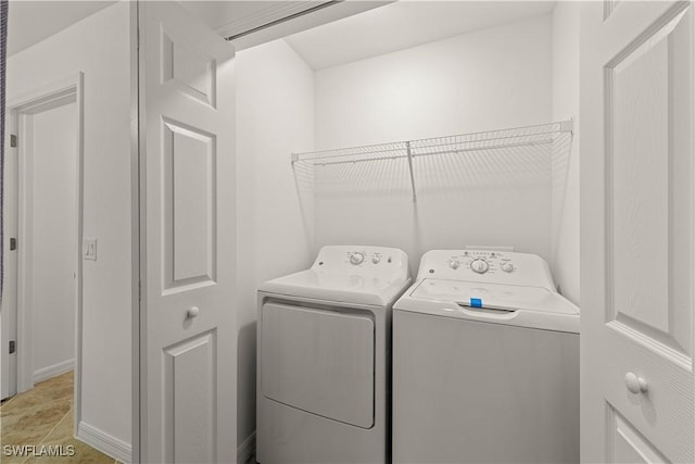 laundry room with laundry area and washer and clothes dryer