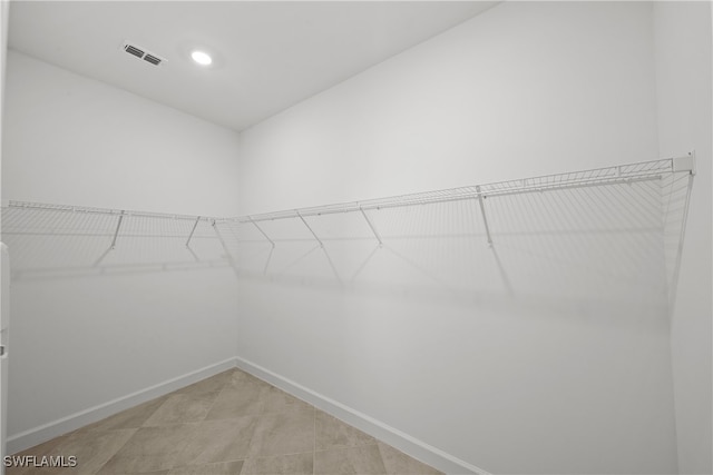 spacious closet featuring visible vents