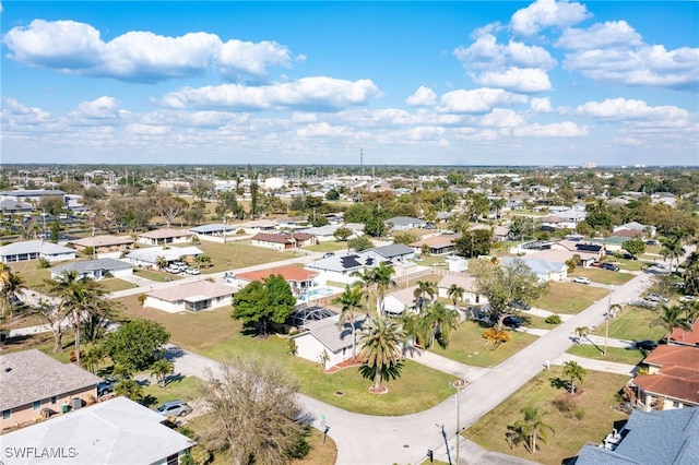 birds eye view of property with a residential view