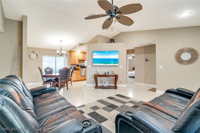 living room featuring ceiling fan with notable chandelier, vaulted ceiling, baseboards, and light tile patterned floors