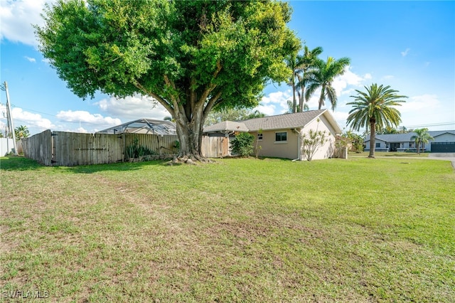 view of yard with fence