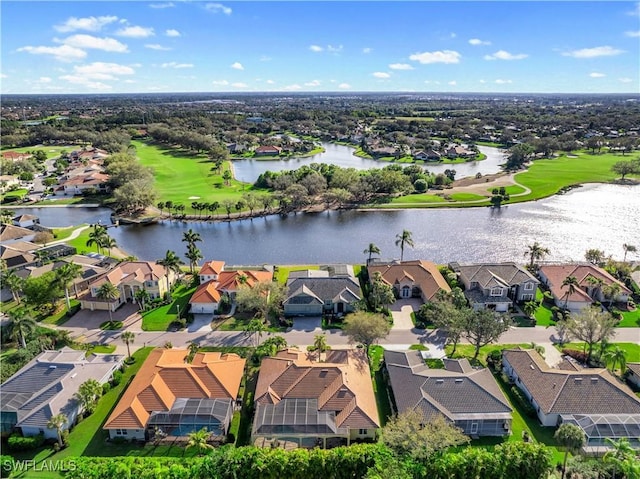 birds eye view of property with a water view and a residential view