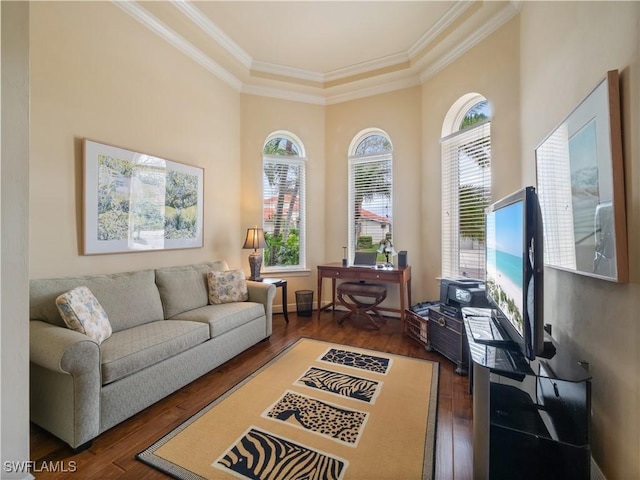 interior space with wood-type flooring, baseboards, and crown molding