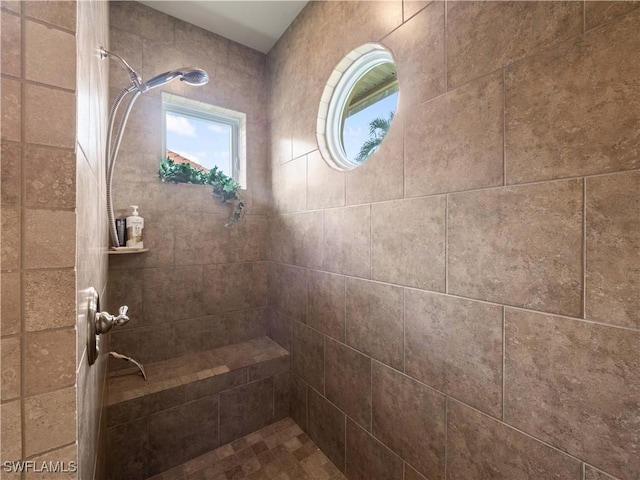 bathroom with tiled shower