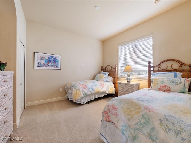 carpeted bedroom with baseboards