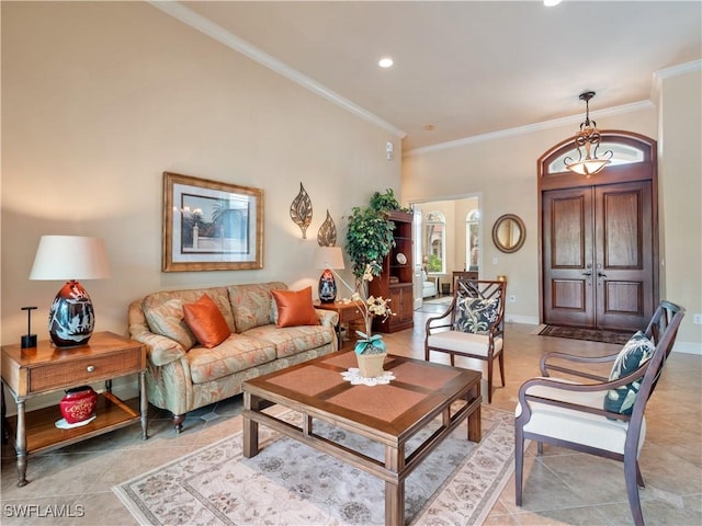 living room featuring baseboards, french doors, recessed lighting, and crown molding