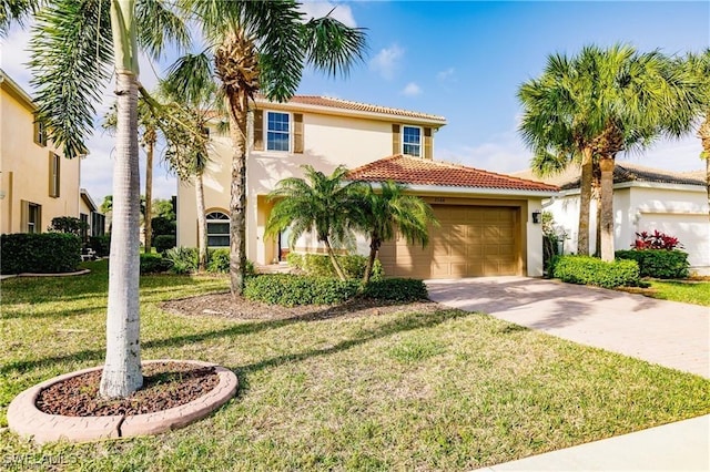 mediterranean / spanish-style house featuring a garage, concrete driveway, a tile roof, a front yard, and stucco siding