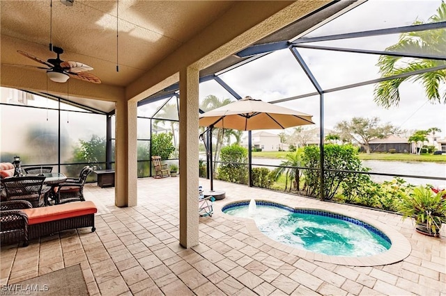 view of swimming pool featuring a lanai, a patio area, ceiling fan, and a hot tub