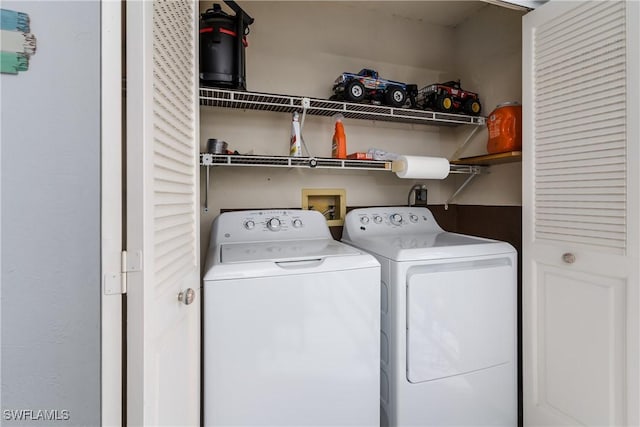 clothes washing area with laundry area and separate washer and dryer