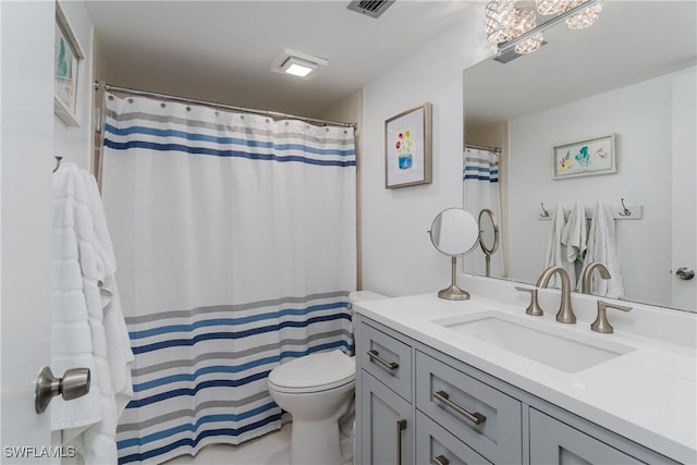 full bath featuring toilet, visible vents, and vanity