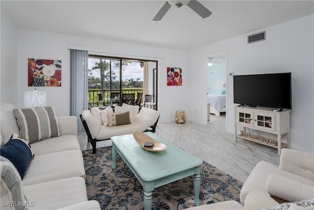 living room featuring marble finish floor, visible vents, and a ceiling fan