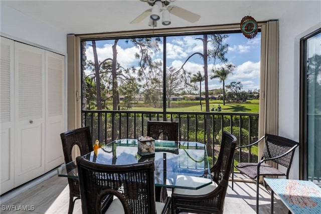 sunroom featuring ceiling fan