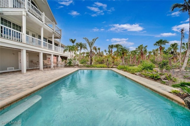 outdoor pool featuring a patio