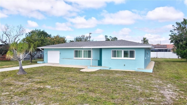 ranch-style home with a front lawn, brick siding, fence, and an attached garage