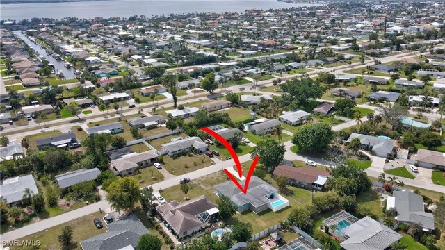 aerial view featuring a water view and a residential view