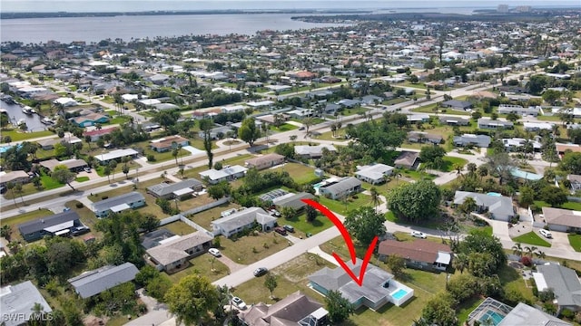 aerial view featuring a water view and a residential view