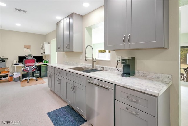 kitchen featuring a sink, stainless steel dishwasher, gray cabinets, and visible vents