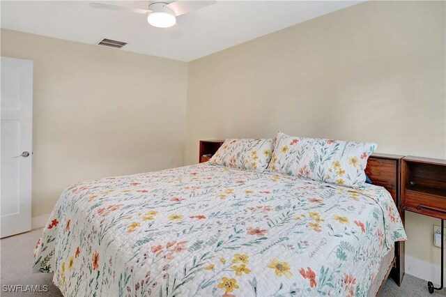 bedroom featuring a ceiling fan, carpet, and visible vents