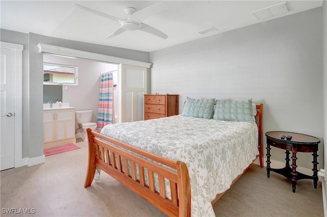 bedroom featuring visible vents, a ceiling fan, and light colored carpet